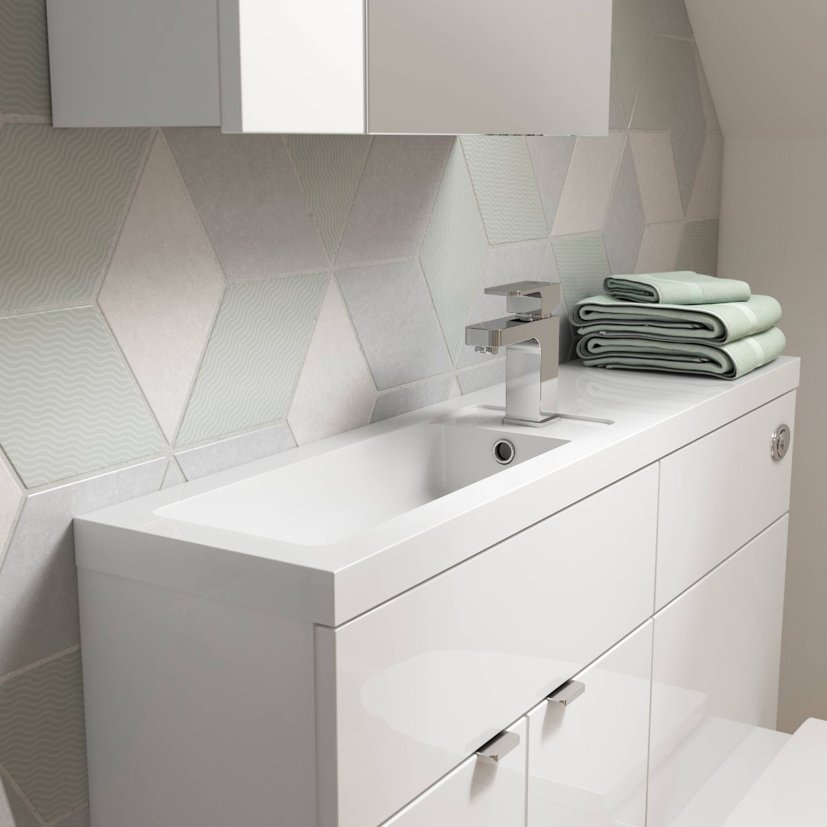 white, green and grey tiles behind small vanity unity