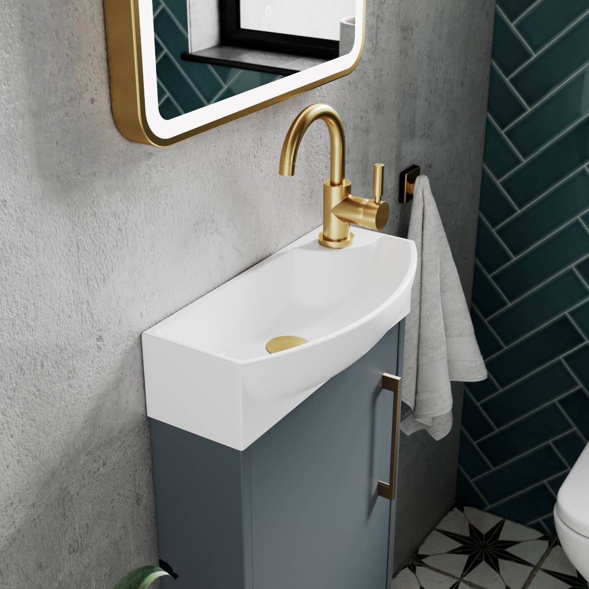 brushed brass taps on small slimline basin