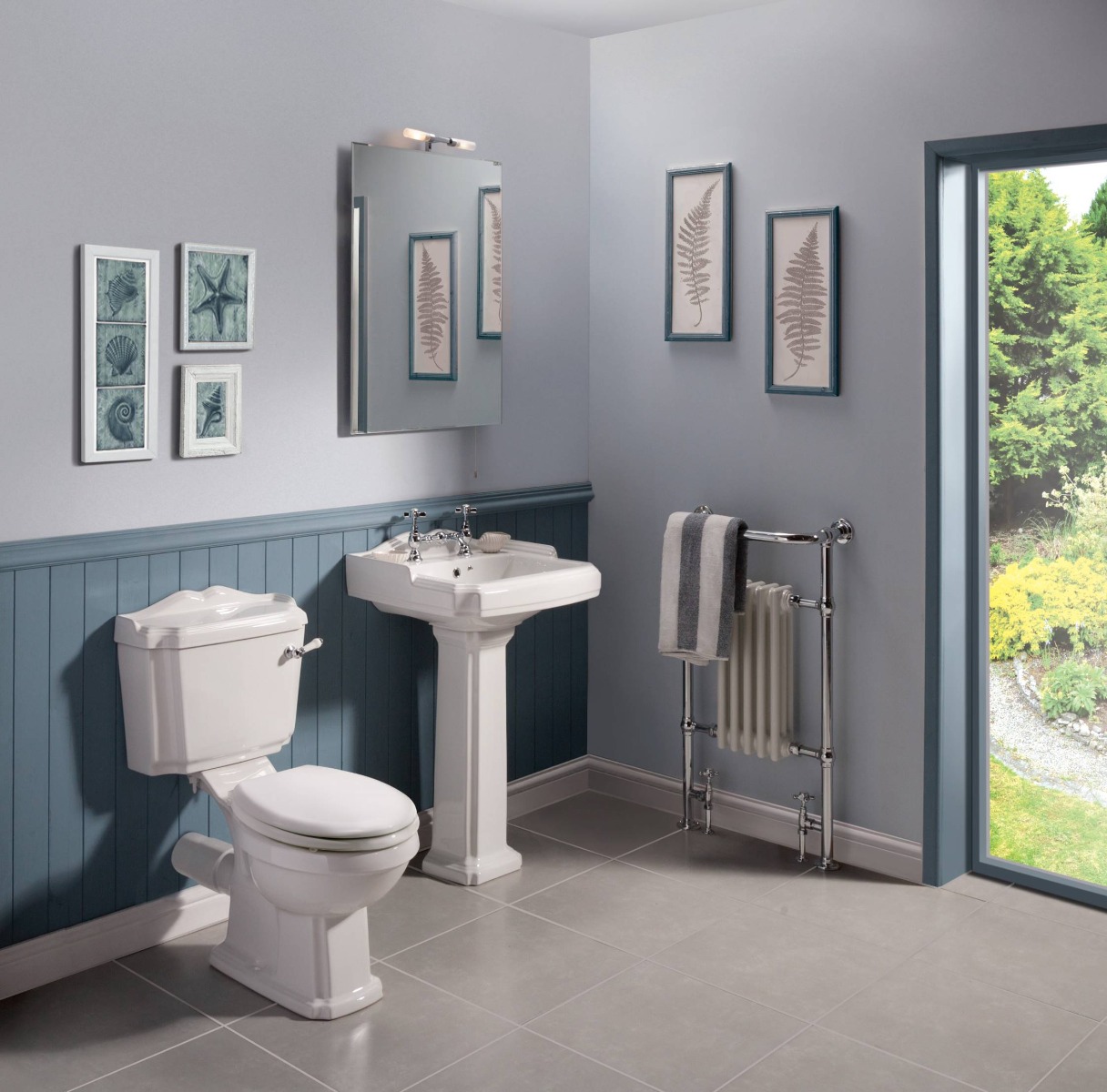 blue bathroom with wood panelling and traditional toilet