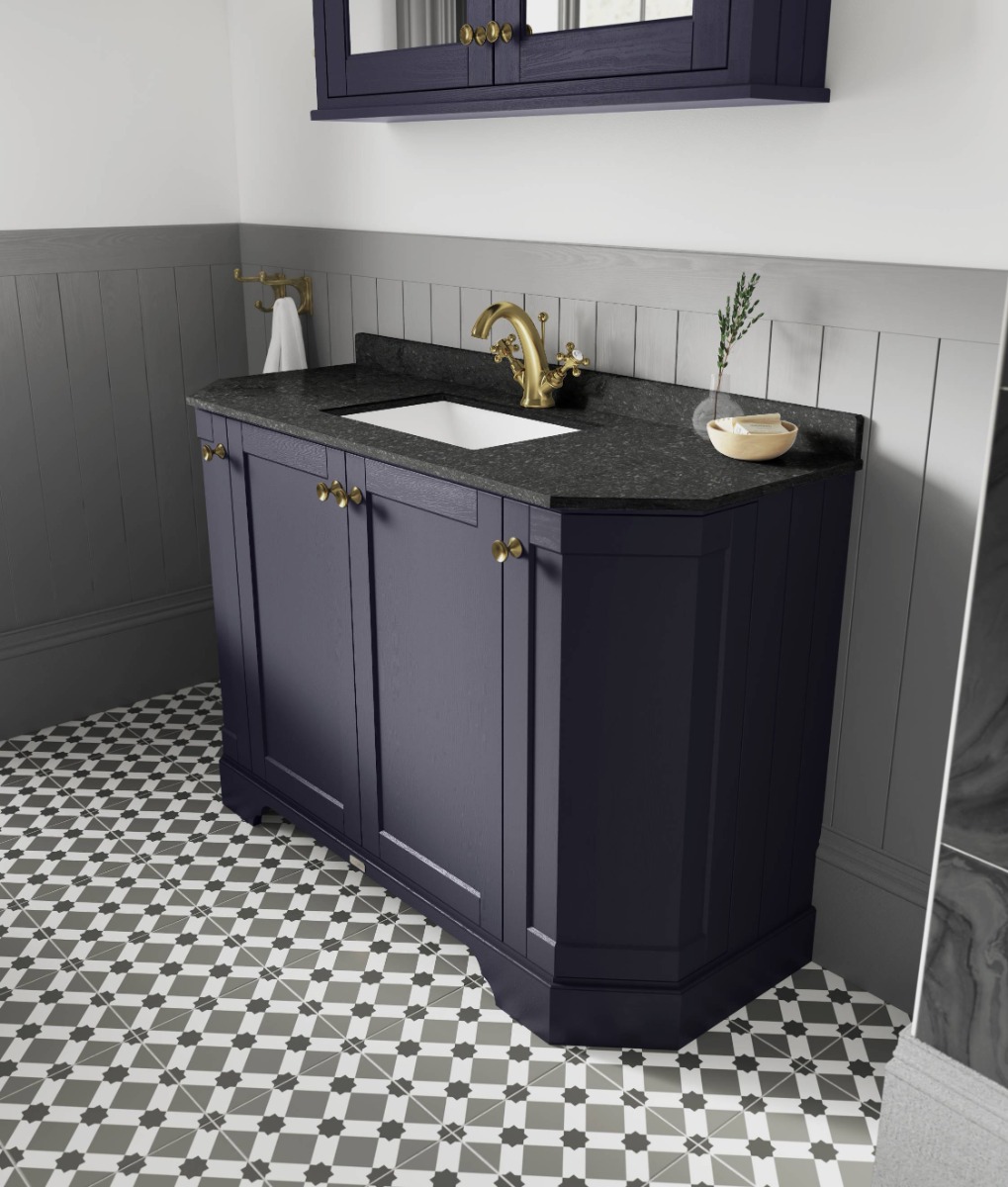 blue vanity unit with brass taps