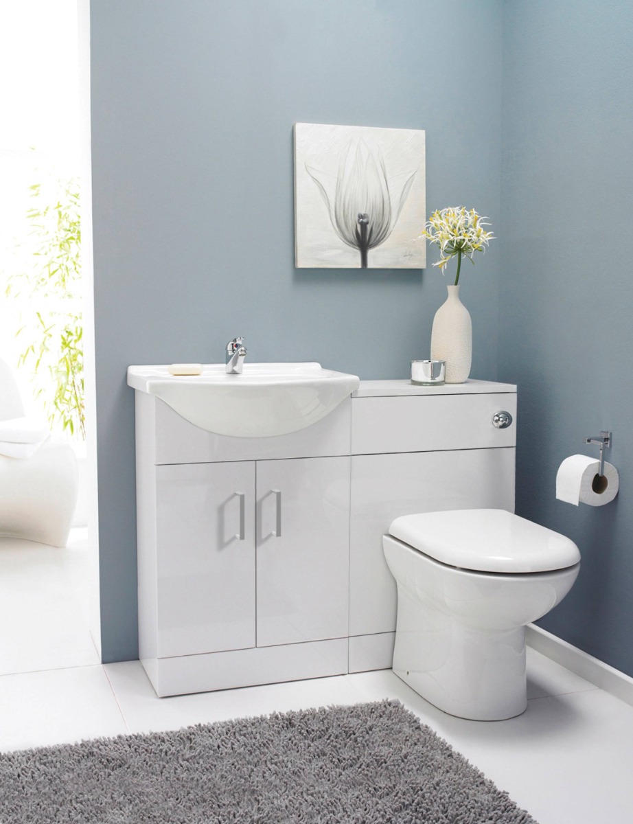light blue bathroom with white vanity unit