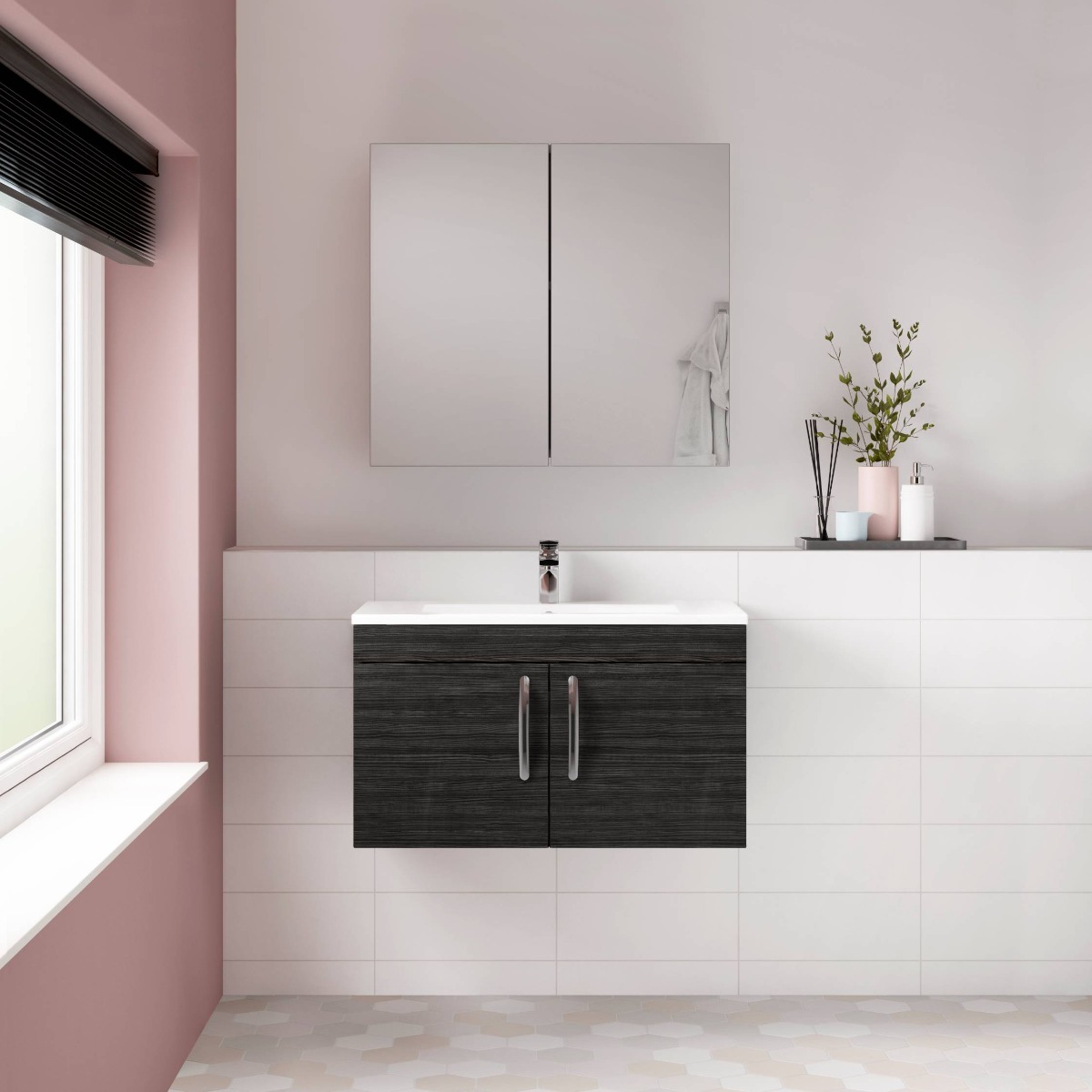 white and pink bathroom with black vanity unit