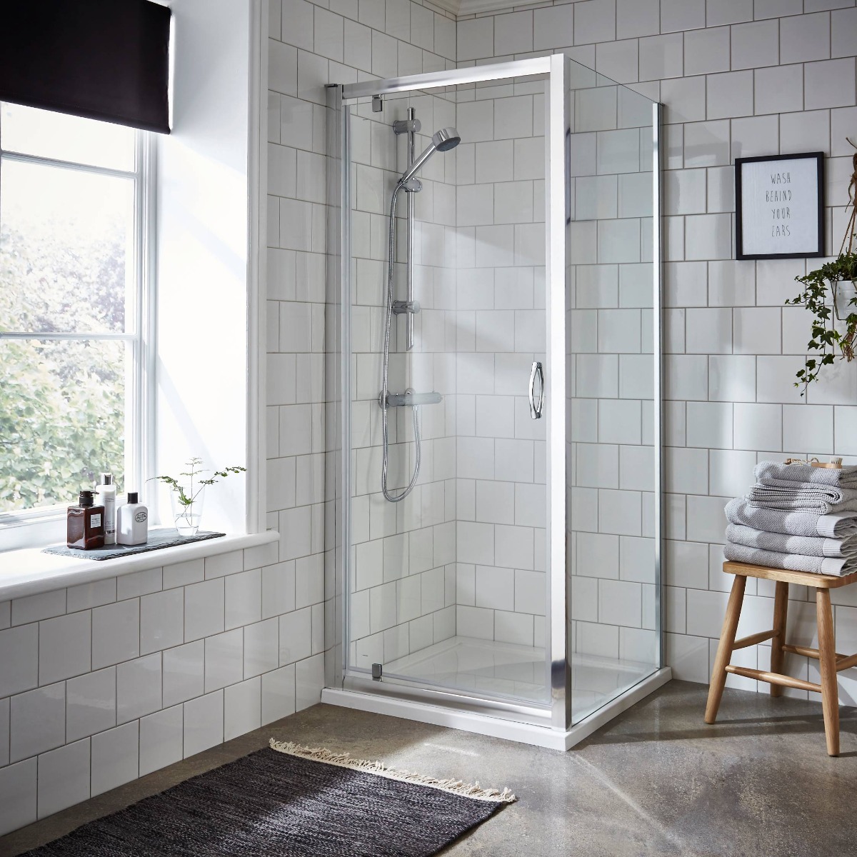 white bathroom tiles with shower