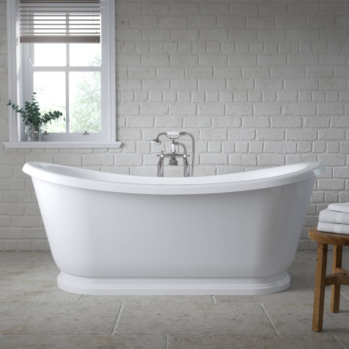 freestanding bath with white brick wall
