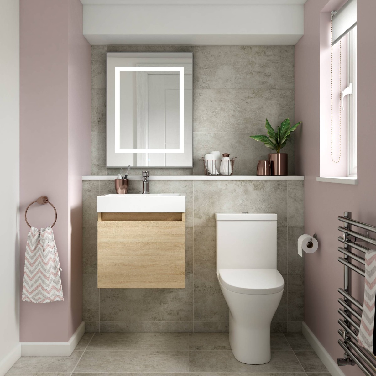 pink bathroom with stone walls and oak vanity unit